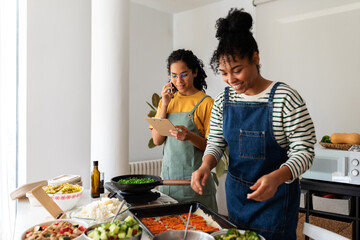 Female cooks preparing food delivery