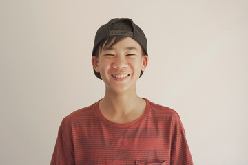 pov portrait of happy, confident and healthy mixed race  Asian preteen teen boy smiling face, youth...