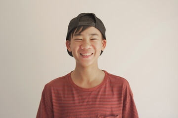 pov portrait of happy, confident and healthy mixed race  Asian preteen teen boy smiling face, youth day