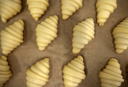Row of croissants on the table