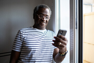Aged man using cellphone