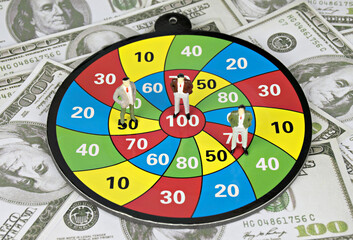 Figures Model,Businessman ,Archery target,score and dollar.Concept goals and business success.