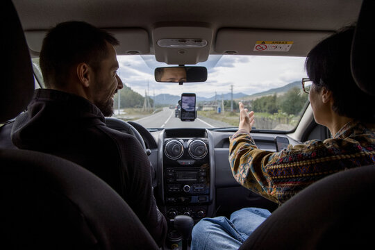 Couple traveling by car