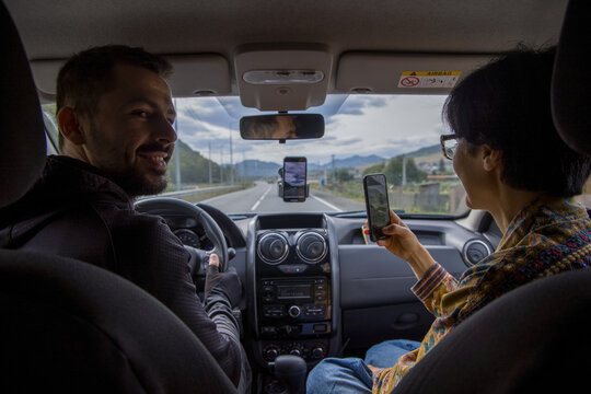 Couple traveling by car
