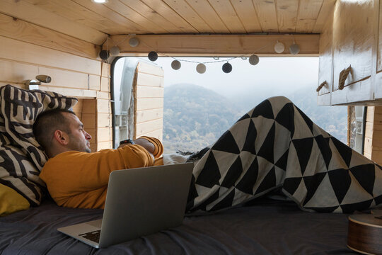 Man in Van Bedroom Enjoying the View
