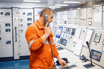 engineer in engine room with Landline phone