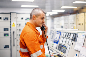 Vessel mechanic talking on the phone