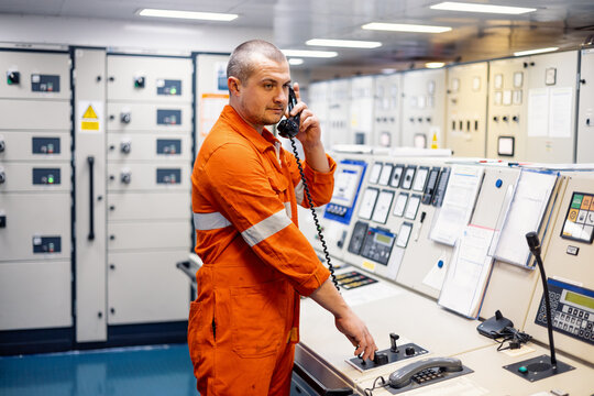 engineer mechanic talking on the phone