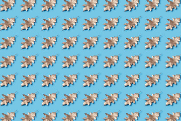 Pattern of painted leaves on blue background