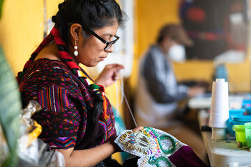 Guatemalan seamstress working in her craft workshop.