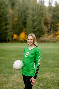 Smiling Teen Holding Volleyball