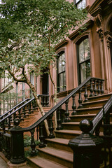 Typical facades of New York City. Brown brick houses in NYC, USA. Urban architecture