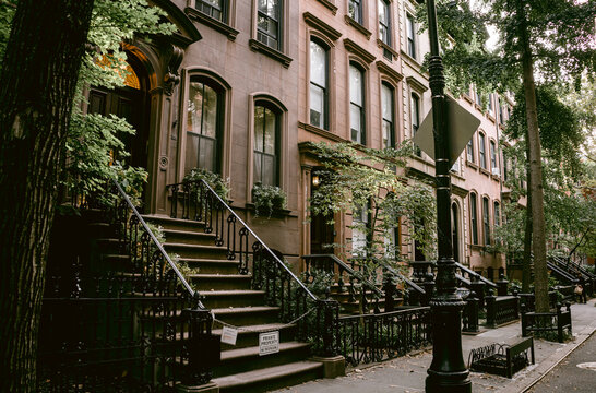 Typical facades of New York City. Brown brick houses in NYC, USA. Urban architecture