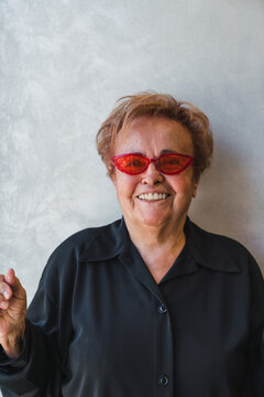 Happy Senior Woman with Cool Red Sunglasses