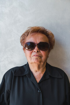 Tough Senior Woman with Dark Sunglasses