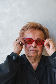 Tough Senior Woman with Cool Red Sunglasses