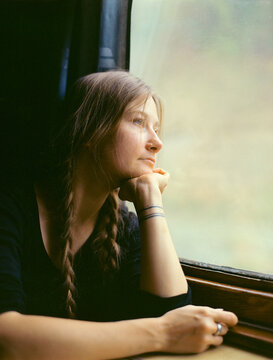 Portrait of woman traveling by train 