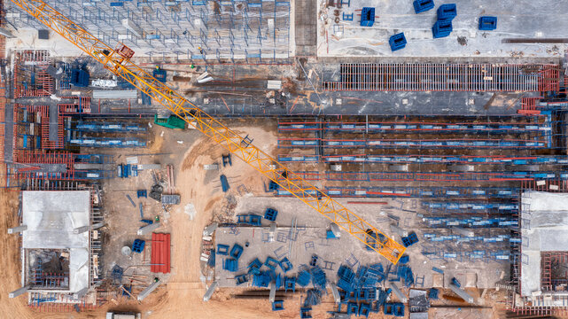 Aerial view construction site with tower crane and building construction site, Construction sites and many cranes and heavy construction working in the industry new building business.