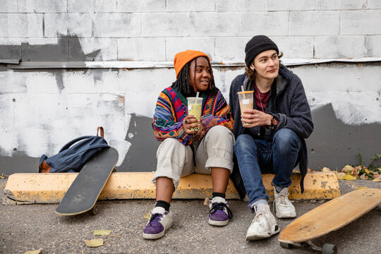 A Young Couple Sitting Together