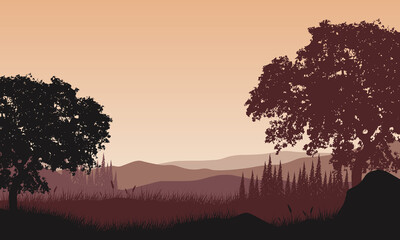 Fototapeta premium Beautiful views of the mountains from the riverbank at dusk with fantastic silhouettes of the surrounding trees.