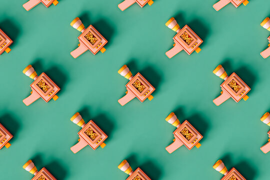 pattern of Super8 vintage camera on green background