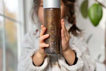 Child with calm down jar