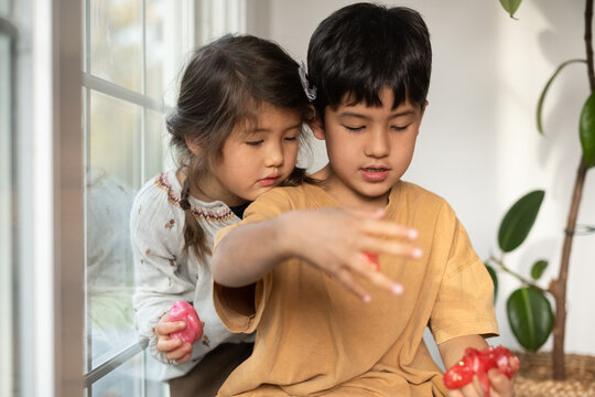 Kids handling slime