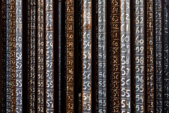 Steel pilings with numbers written on them