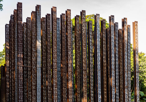 Steel pilings with numbers create pattern 