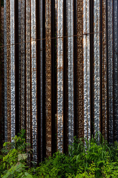 Steel pilings emerge with numbers at construction site