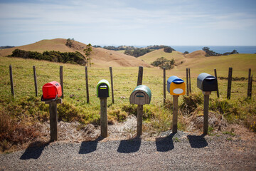 Colorful letterboxes on a rural road