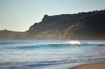 Surfers await waves on a stunning New Zealand morning