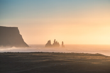 Reynisdrangar in warm morning light.