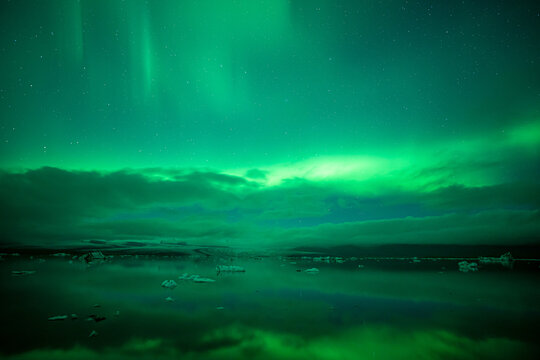 Northern lights over glacial lagoon.