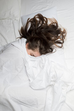 Woman Sleeping On The Bed