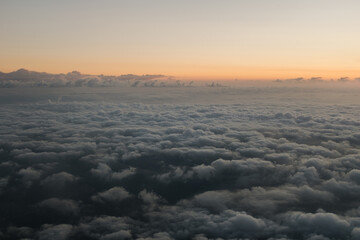Sky full of fluffy clouds in sunrise