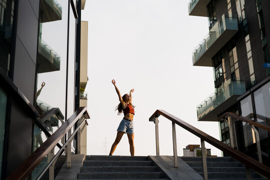 A woman dancing in the city