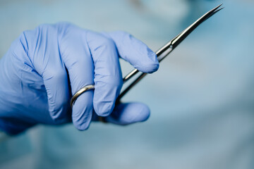 Doctor holding surgical tool