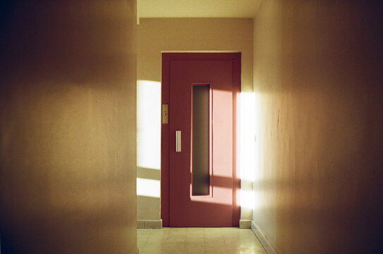 The lift door, leaving home in a sunny afternoon
