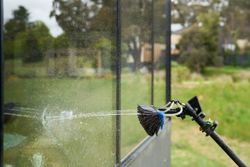 Jet spray window cleaning brush