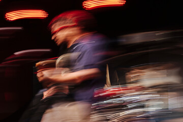 Unrecognizable guitarist in stage with glowing lights