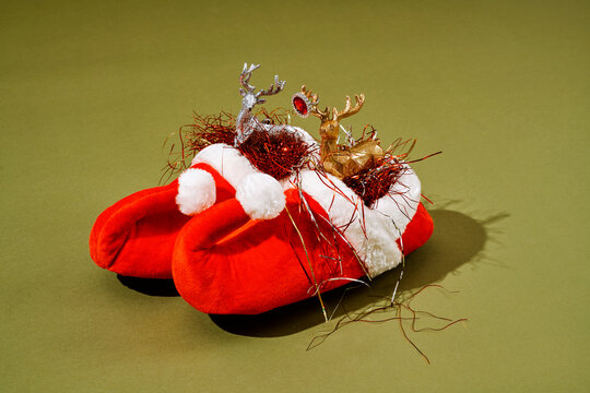 toy reindeers in the red pointy shoes of a Santas elf