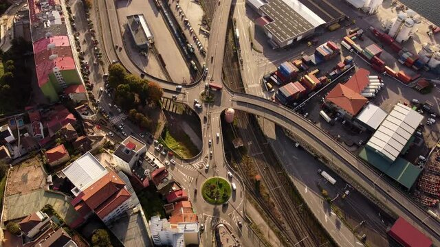 Aerial Birdseye view above Vigo spain highway roundabout flyover traffic turning below