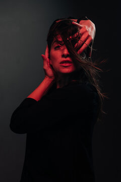 dedicated posing woman lit by red light