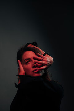 mystic dance of a woman lit by red light