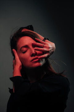 red light closeup portrait of a beautiful woman 