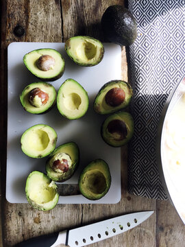 Fresh cut avocado on wooden table