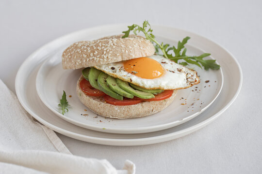 Avocado and egg sandwich on bagel