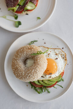 Avocado and egg sandwich on bagel