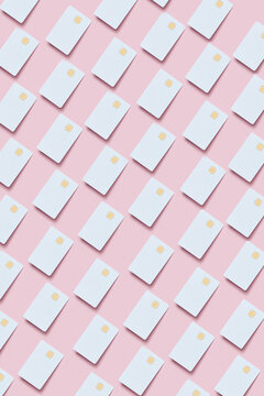 Pattern of credit cards on pink background